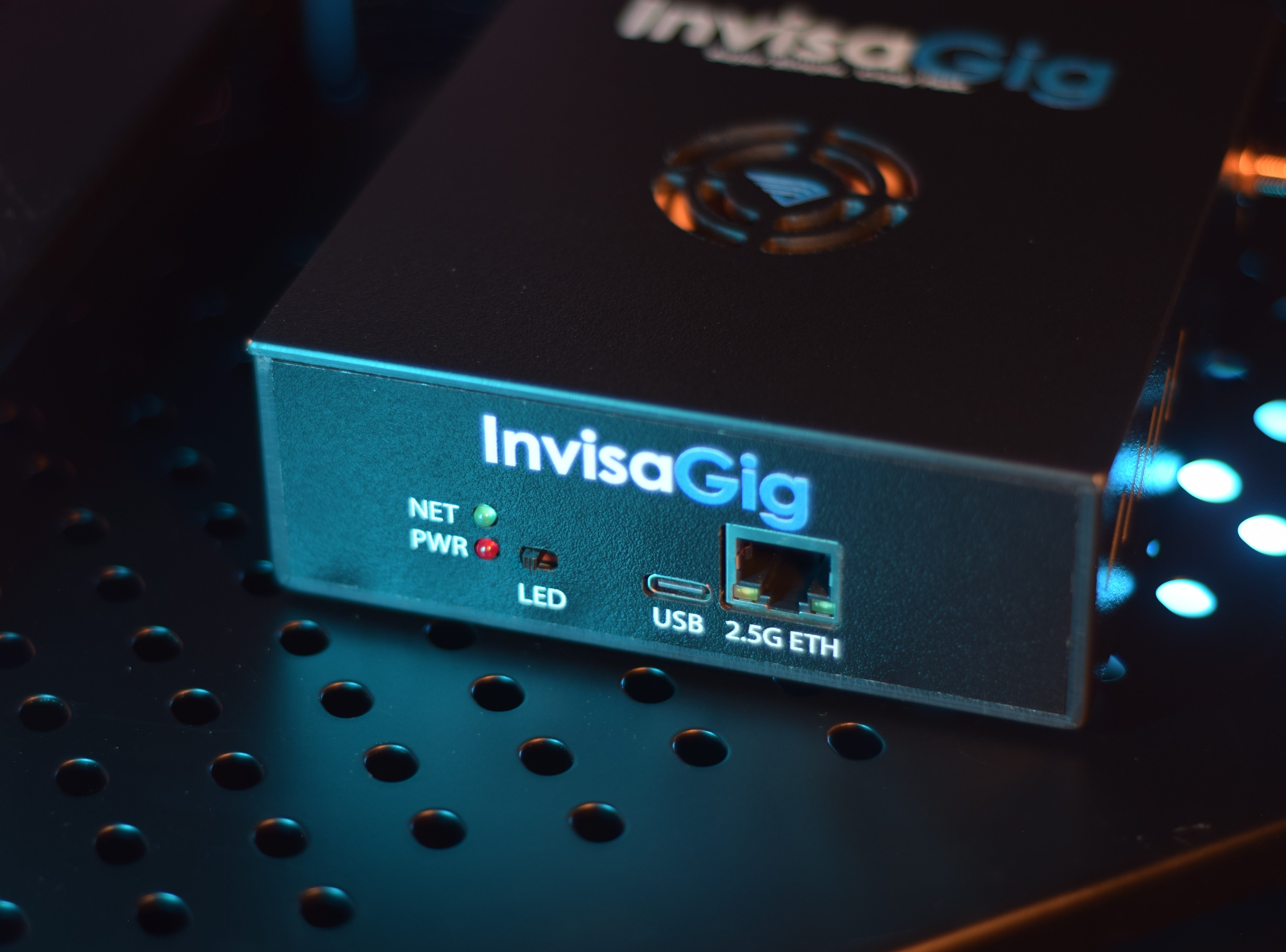 InvisaGig device on a dark background