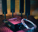 Invisagig router with a cable on a perforated surface