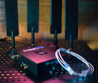 Invisagig router with a cable on a perforated surface